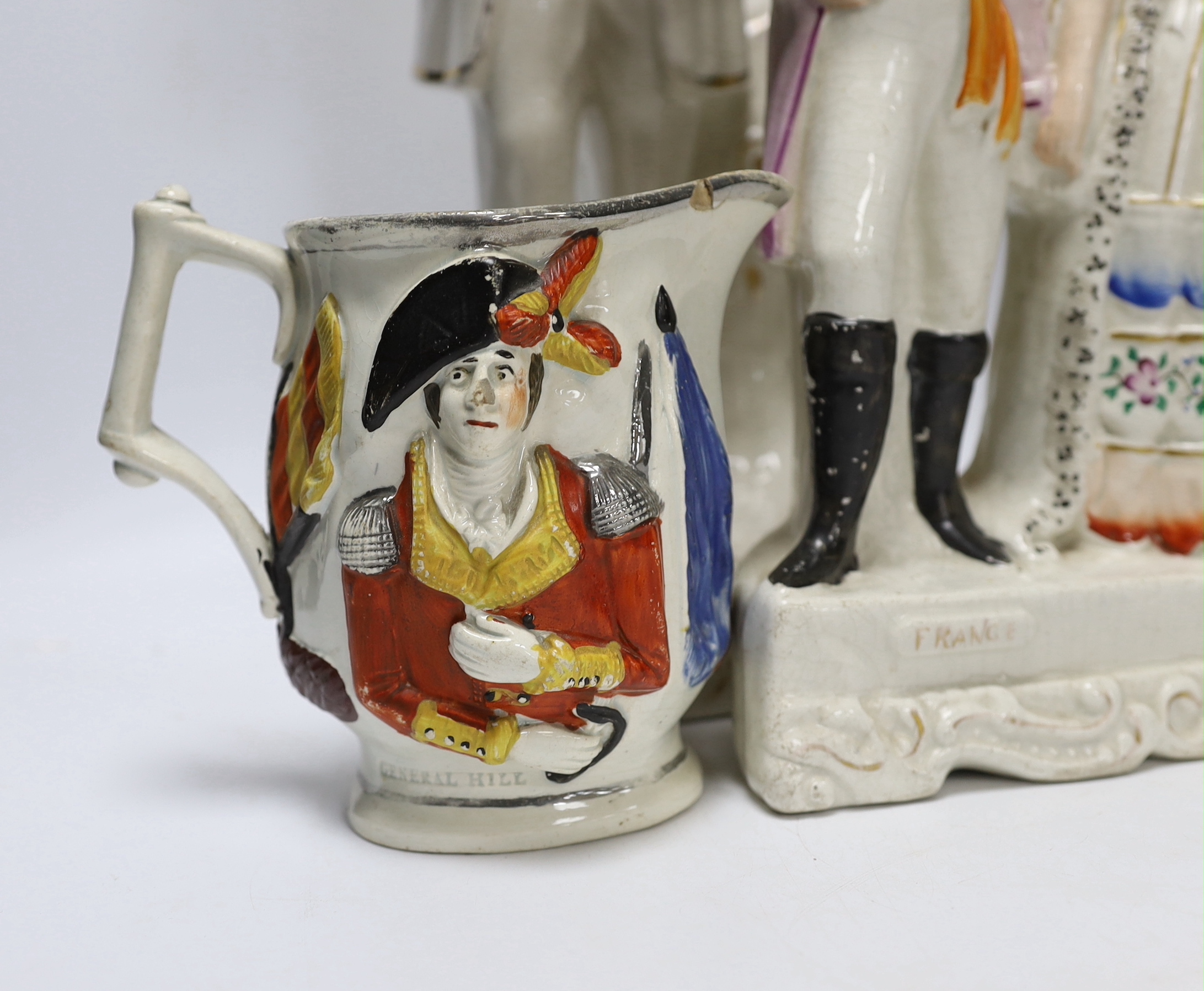 Military and Political Staffordshire figures - A Crimean war group of France, England and Turkey, a figure of Wellington as Prime Minister, a figure of Gladstone, a Nelson Toby jug and a General Hill/Marquis Wellington c